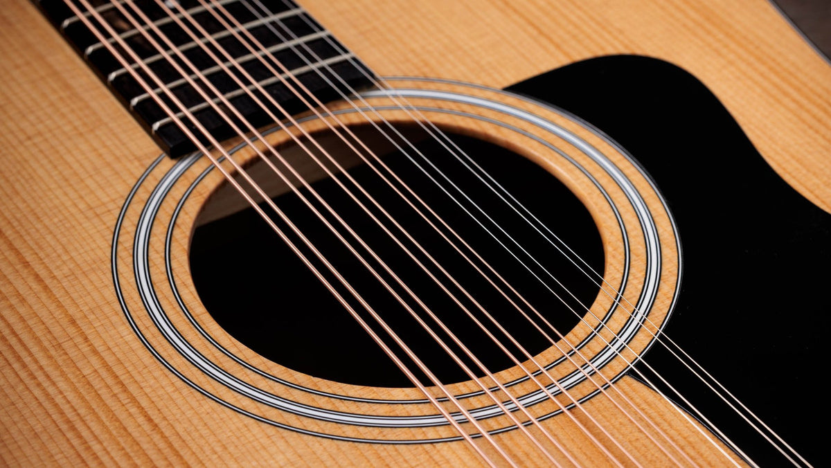 Đàn guitar acoustic điện Taylor 150ce Doce Doble màu Natural – cận hoa văn viền lỗ thoát âm (rosette)