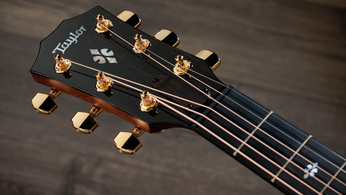 Đàn guitar acoustic điện Taylor 712ce – cận đầu đàn và logo Taylor