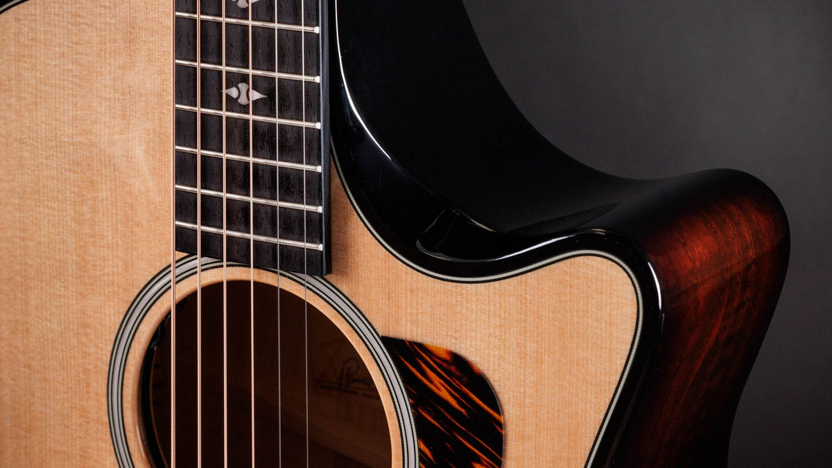 Đàn guitar acoustic điện Taylor Builder's Edition 514ce mặt Natural, lưng hông Kona Burst – cận lỗ thoát âm và ngựa đàn
