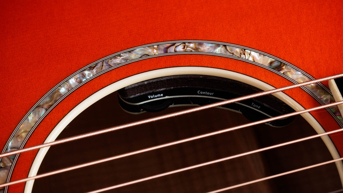 Đàn guitar acoustic điện Taylor Doyle Dykes Signature Model màu Translucent Orange – cận hoa văn viền lỗ thoát âm (rosette)