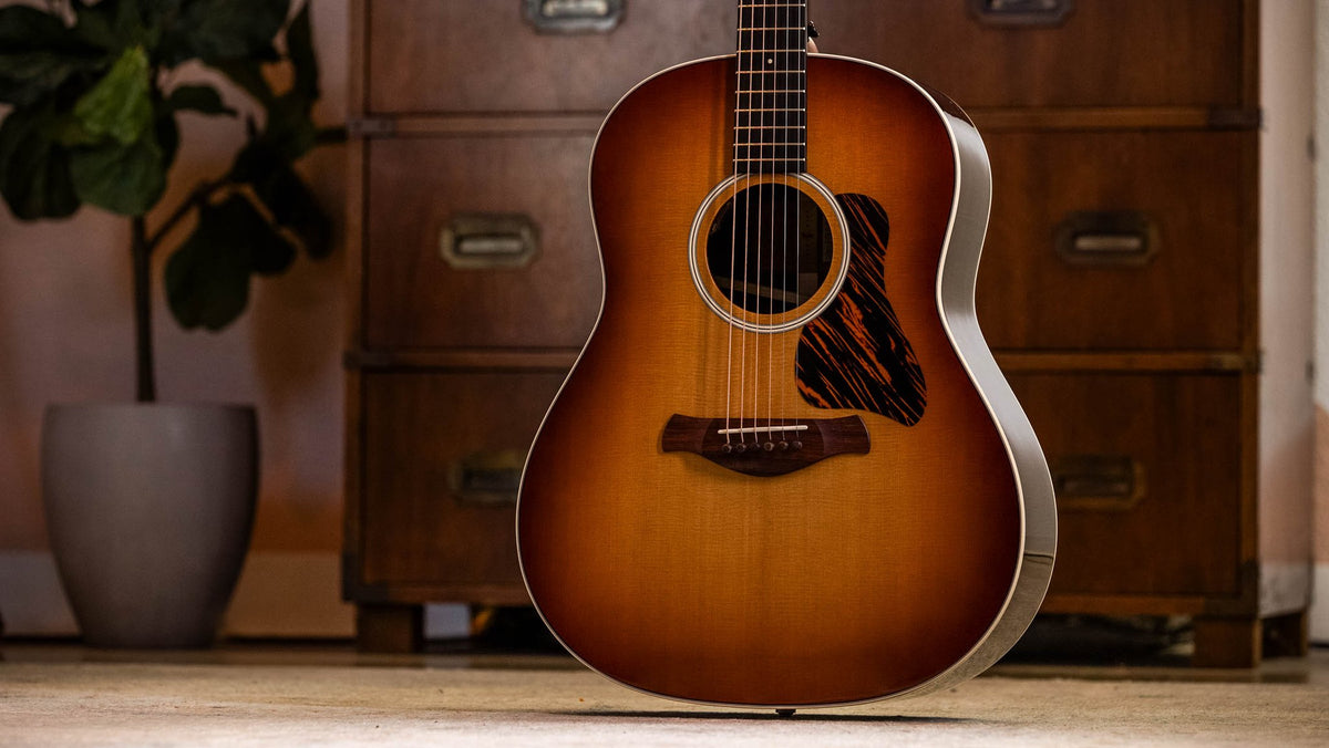 Đàn guitar acoustic điện Taylor Gold Label 717e mặt sunburst nâu vàng, pickguard firestripe – ảnh chính hãng chụp nằm ngang