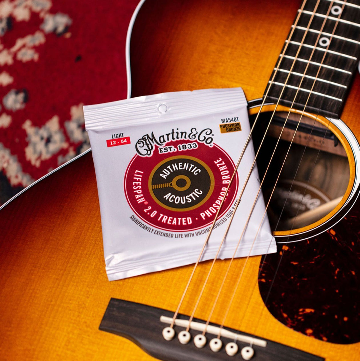 Dây Martin MA540T Lifespan 2.0 Phosphor Bronze 12-54 Light đặt trên đàn guitar acoustic