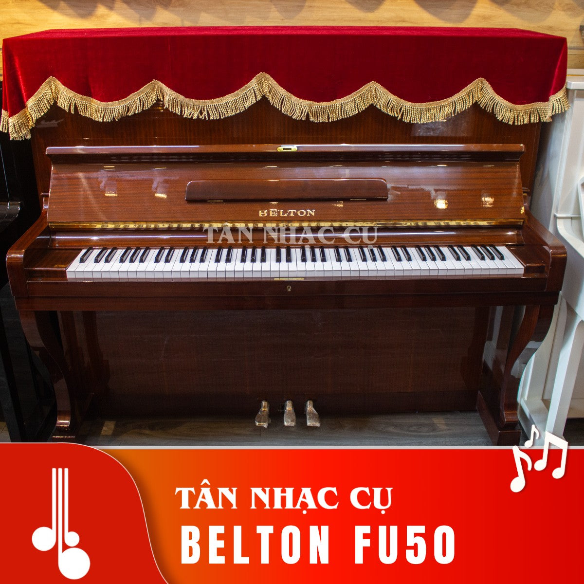 Đàn piano cơ TÂN NHẠC CỤ Belton FU50 màu vân gỗ nâu cổ điển với khăn phủ đỏ sang trọng