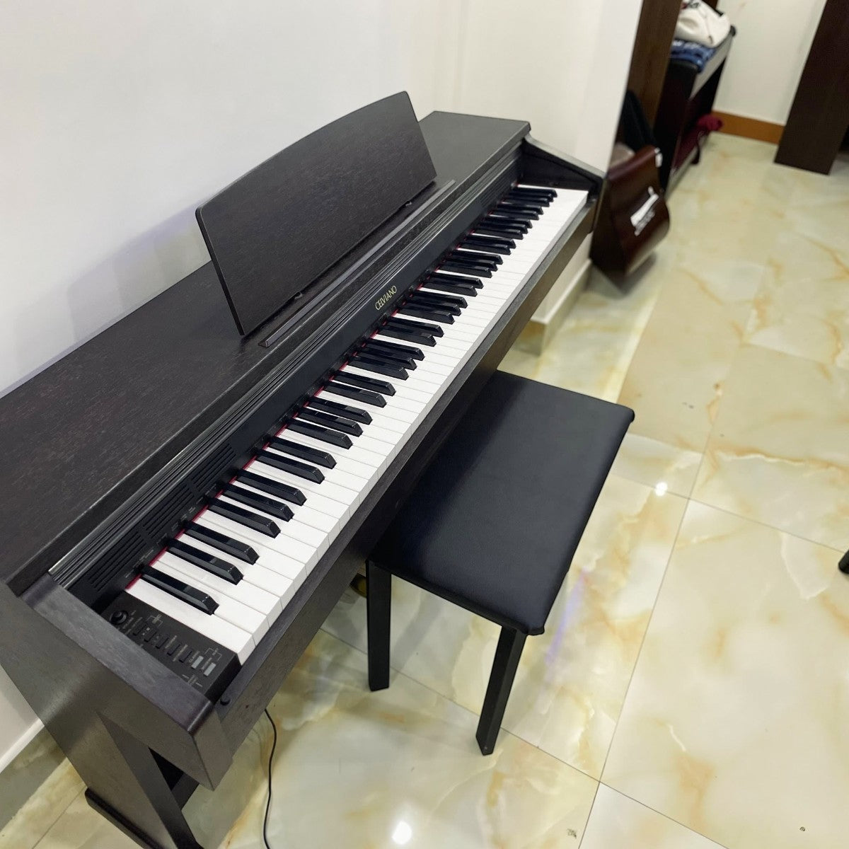Đàn piano điện Casio AP200 màu đen dáng tủ Celviano với bàn phím búa 88 phím tại TÂN NHẠC CỤ