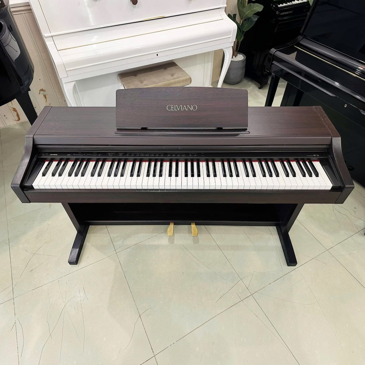 Đàn piano điện Casio AP21 dáng tủ màu nâu gỗ tại TÂN NHẠC CỤ với bàn phím búa 88 phím chắc chắn