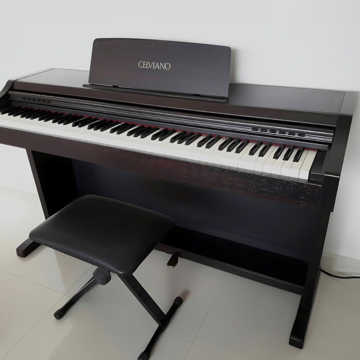 Đàn piano điện TÂN NHẠC CỤ Casio AP21 dáng tủ màu nâu đen với bàn phím búa 88 phím và ghế ngồi đi kèm