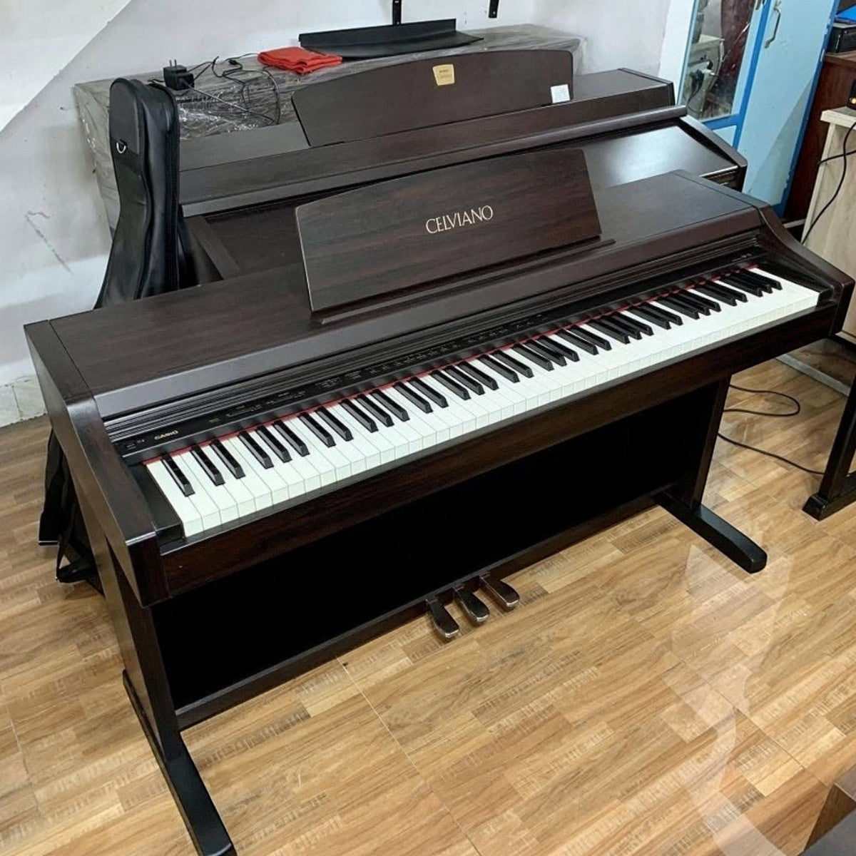 Đàn piano điện Casio AP21 dáng tủ màu nâu gỗ sang trọng với bàn phím búa 88 phím tại TÂN NHẠC CỤ