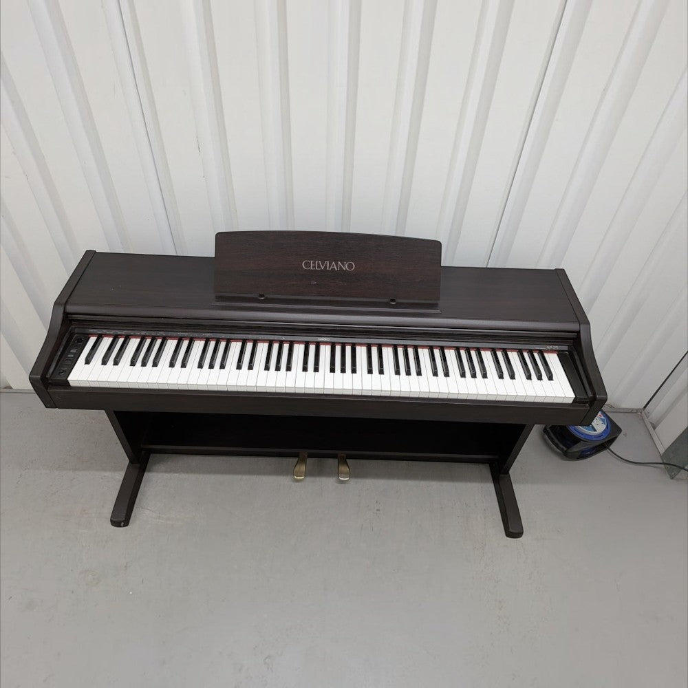 Đàn piano điện Casio AP25 Celviano màu nâu gỗ với thiết kế dáng tủ sang trọng tại Tân Nhạc Cụ