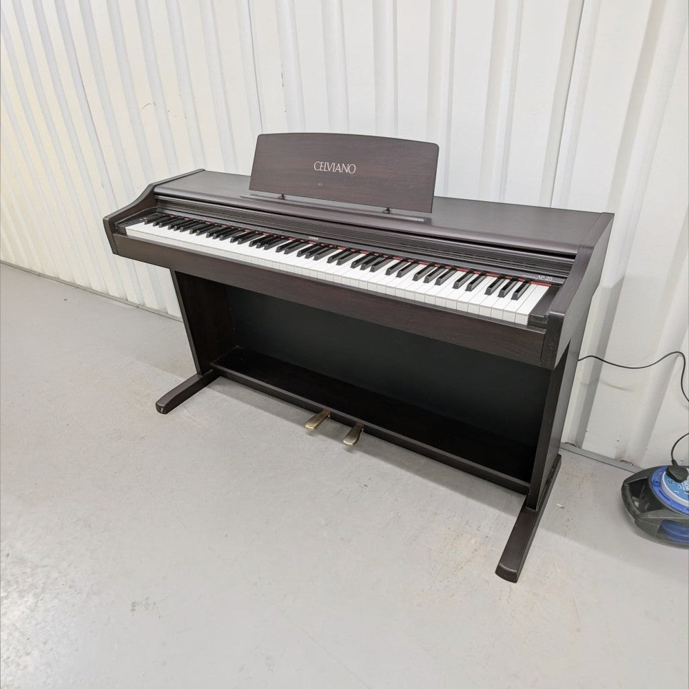 Đàn piano điện Casio AP25 dáng tủ màu nâu gỗ sang trọng tại TÂN NHẠC CỤ với bàn phím búa 88 phím tiêu chuẩn