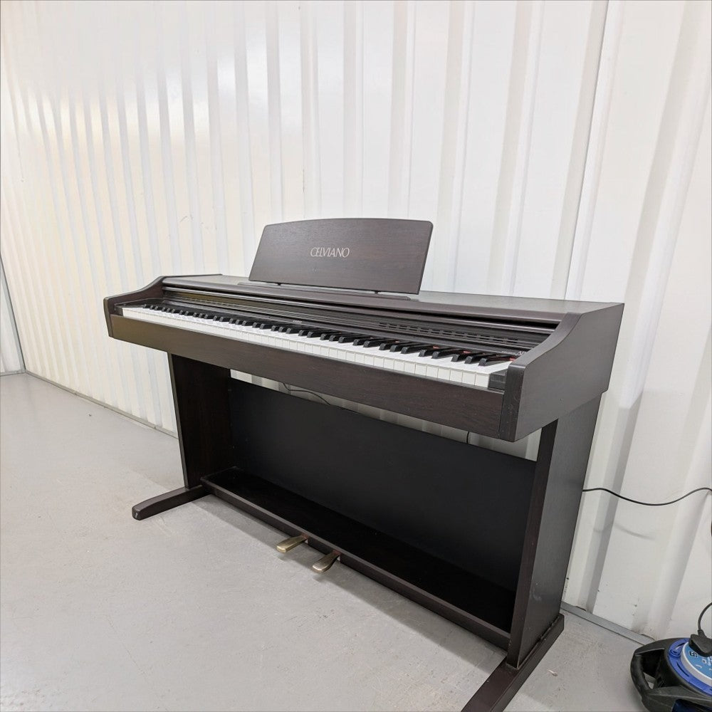 Đàn piano điện Casio AP25 dáng tủ màu nâu gỗ sang trọng với 88 phím búa tại TÂN NHẠC CỤ