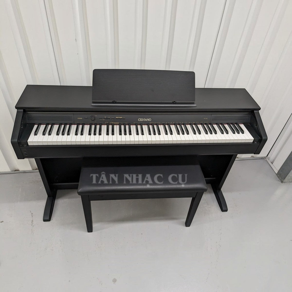 Đàn piano điện Casio AP260 màu đen dáng tủ tại TÂN NHẠC CỤ, kèm ghế ngồi, thiết kế sang trọng cho gia đình.