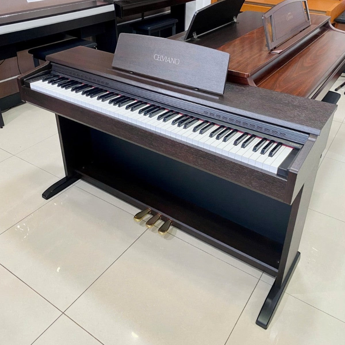 Đàn piano điện Casio AP26 Celviano màu nâu gỗ với 88 phím búa tại showroom TÂN NHẠC CỤ
