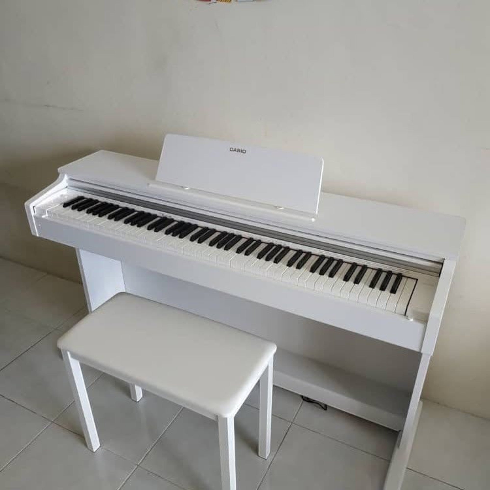 Đàn piano điện Casio AP-270 màu trắng sang trọng tại TÂN NHẠC CỤ, thiết kế dáng tủ hiện đại kèm ghế đồng bộ