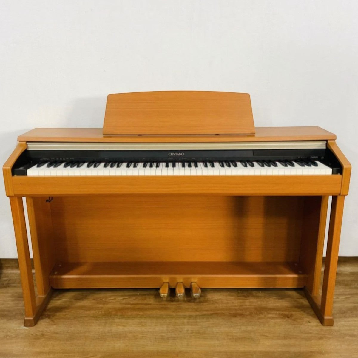 Đàn piano điện TÂN NHẠC CỤ Casio AP-400 dáng tủ màu gỗ tự nhiên với 88 phím búa và 3 pedal sang trọng