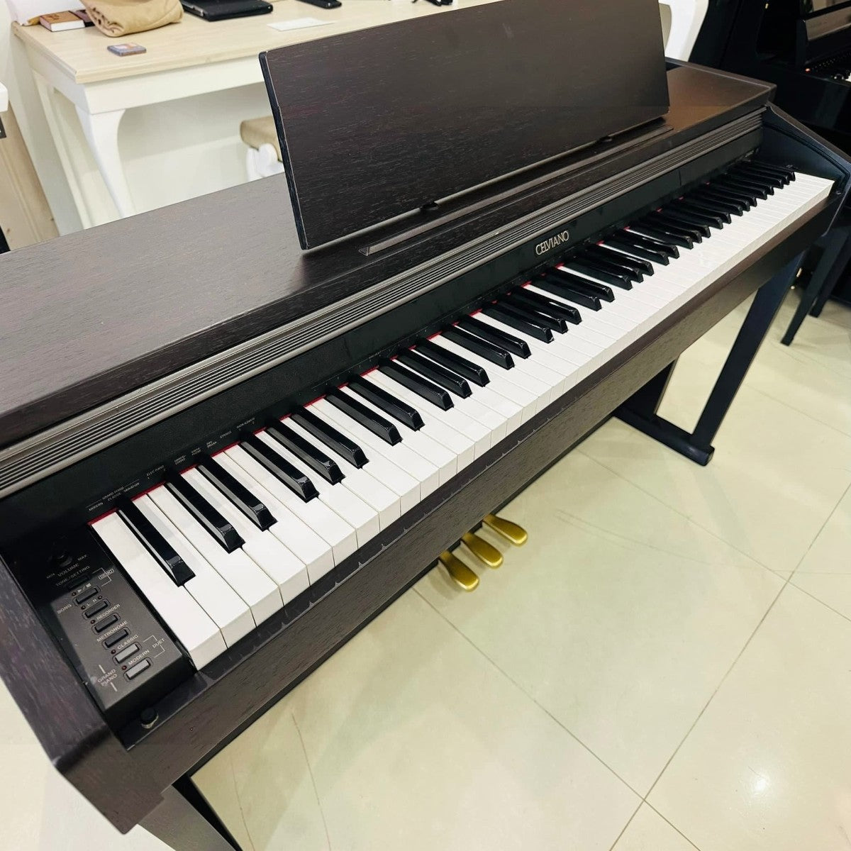 Đàn piano điện Casio AP-400 Celviano màu gỗ tối sang trọng với thiết kế dáng tủ tại cửa hàng TÂN NHẠC CỤ
