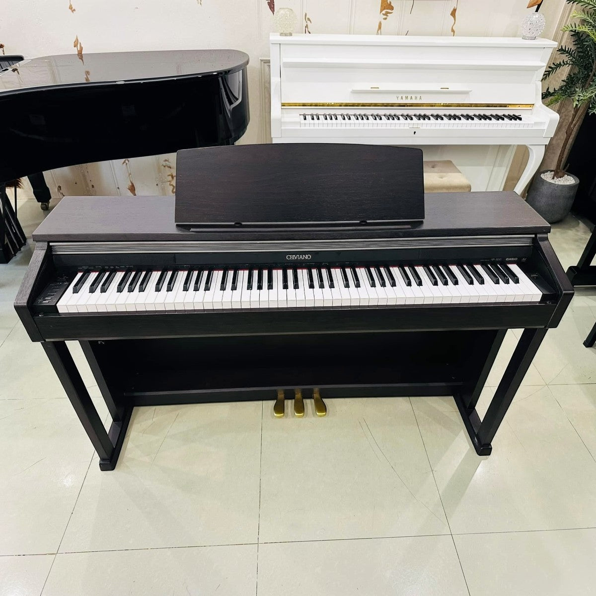 Đàn piano điện TÂN NHẠC CỤ Casio AP-400 dáng tủ màu nâu gỗ sang trọng với 88 phím búa và 3 pedal vàng