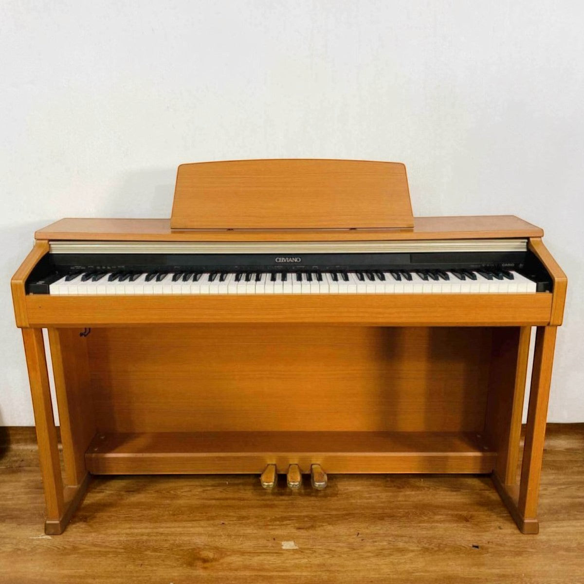 Đàn piano điện TÂN NHẠC CỤ Casio AP-400 dáng tủ màu gỗ tự nhiên với 88 phím búa và 3 pedal sang trọng