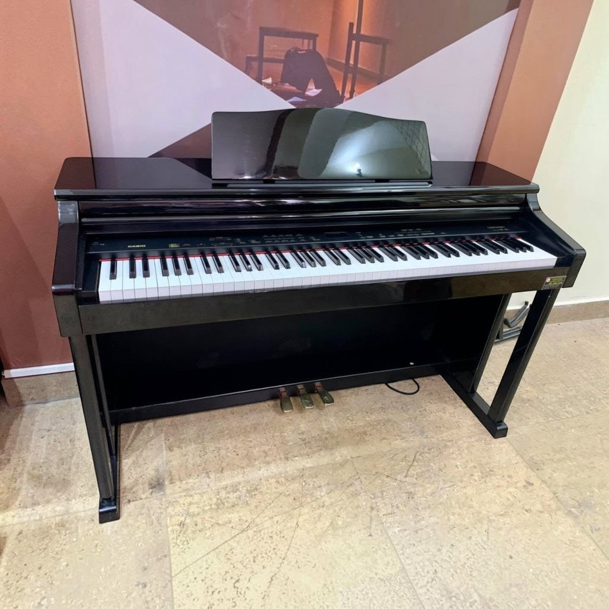 Đàn piano điện Casio AP40 màu đen dáng tủ sang trọng tại TÂN NHẠC CỤ, thiết kế 88 phím búa đàn và 3 pedal cố định.