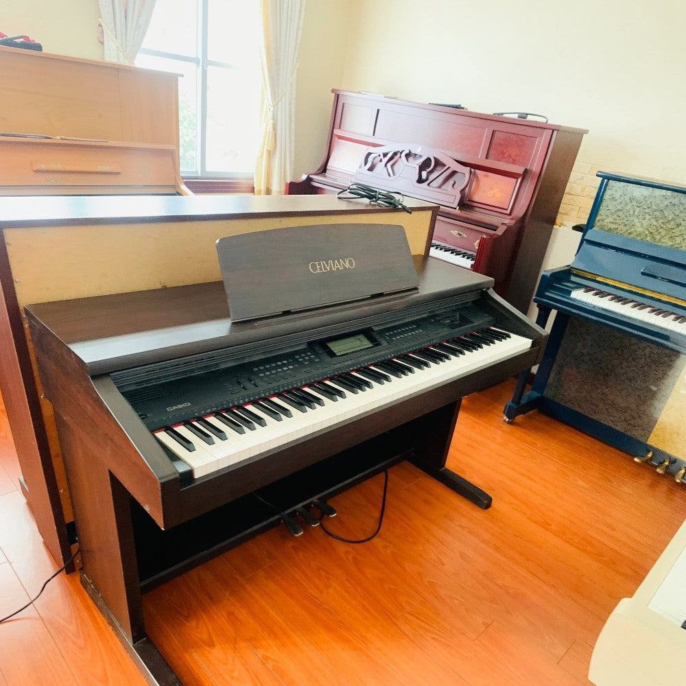 Đàn piano điện Casio AP-60 dòng Celviano dáng tủ màu nâu gỗ tại showroom Tân Nhạc Cụ