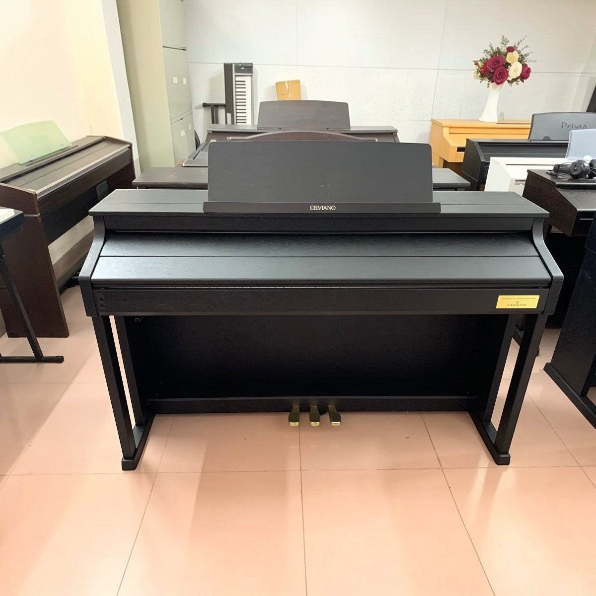 Đàn piano điện TÂN NHẠC CỤ Casio AP-710 màu đen sa tanh với thiết kế dáng tủ sang trọng tại showroom
