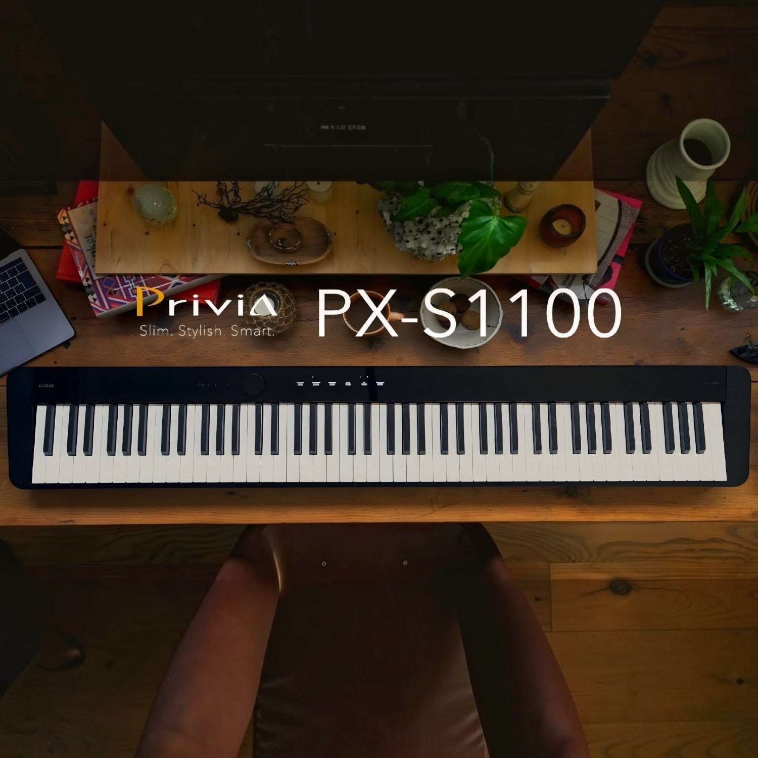 Đàn piano điện Casio PX-S1100 màu đen mỏng gọn đặt trên bàn làm việc tại TÂN NHẠC CỤ