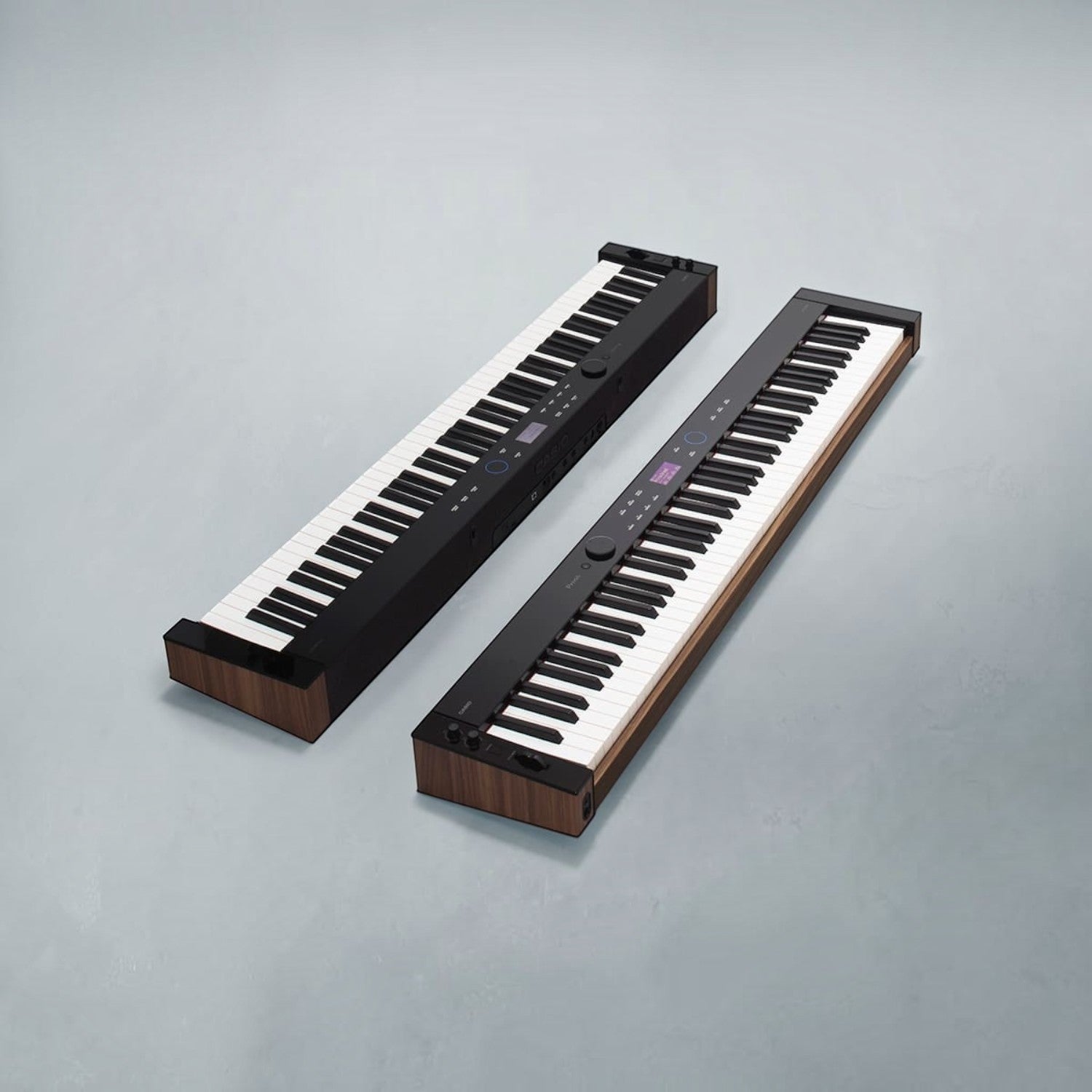Hai cây đàn piano điện Casio PX-S6000 màu đen sang trọng tại Tân Nhạc Cụ với thiết kế mỏng và bàn phím gỗ composite.