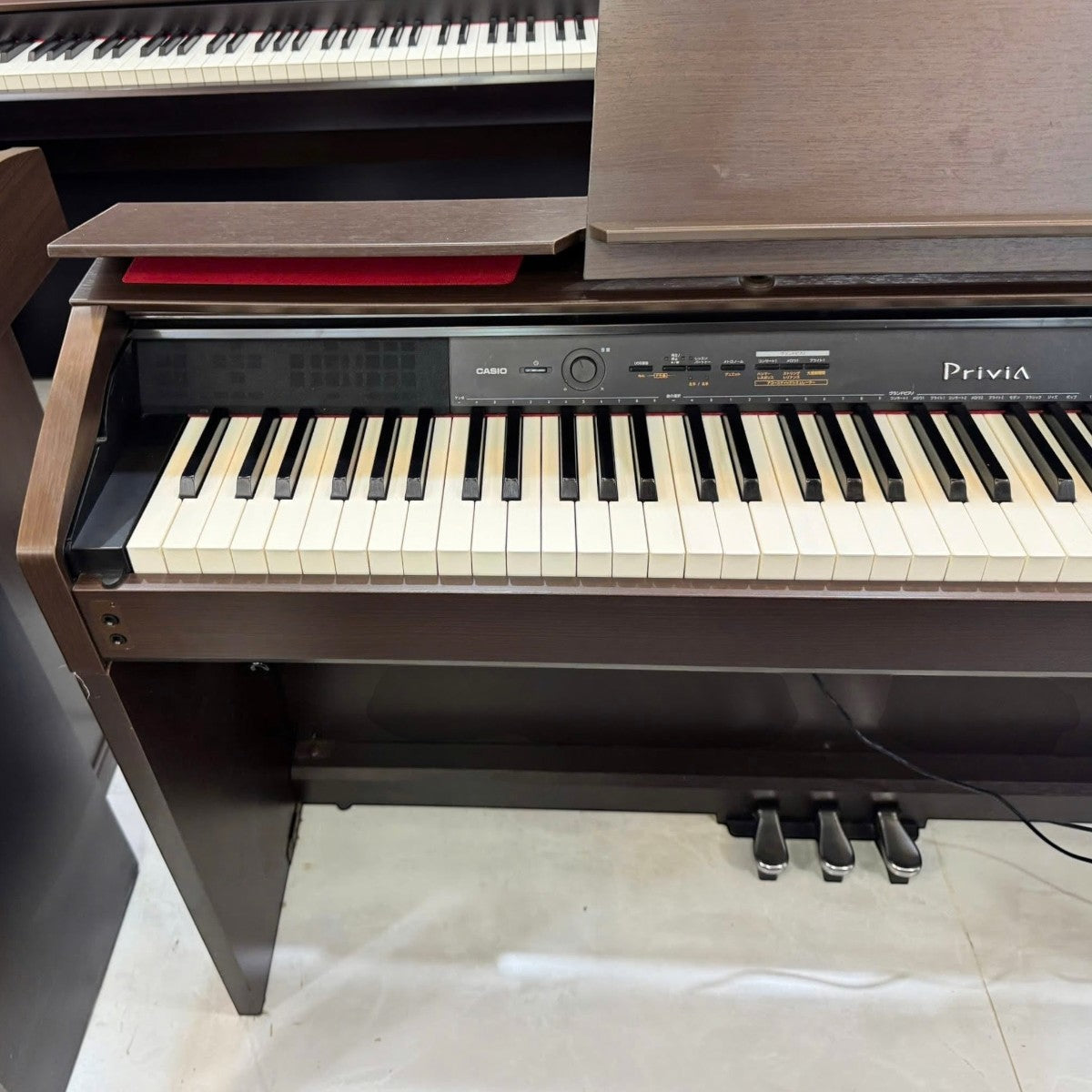 Đàn piano điện TÂN NHẠC CỤ Casio PX-1200GP dáng console màu nâu gỗ với bàn phím 88 phím búa và 3 pedal
