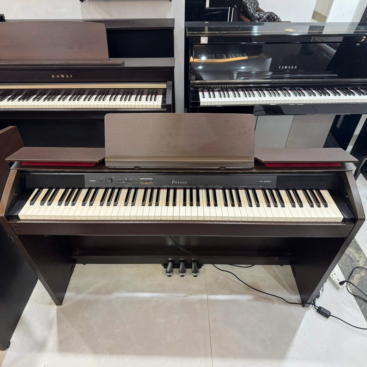 Đàn piano điện TÂN NHẠC CỤ Casio PX-1200GP dáng console màu nâu sang trọng với bàn phím 88 phím búa Tri-Sensor