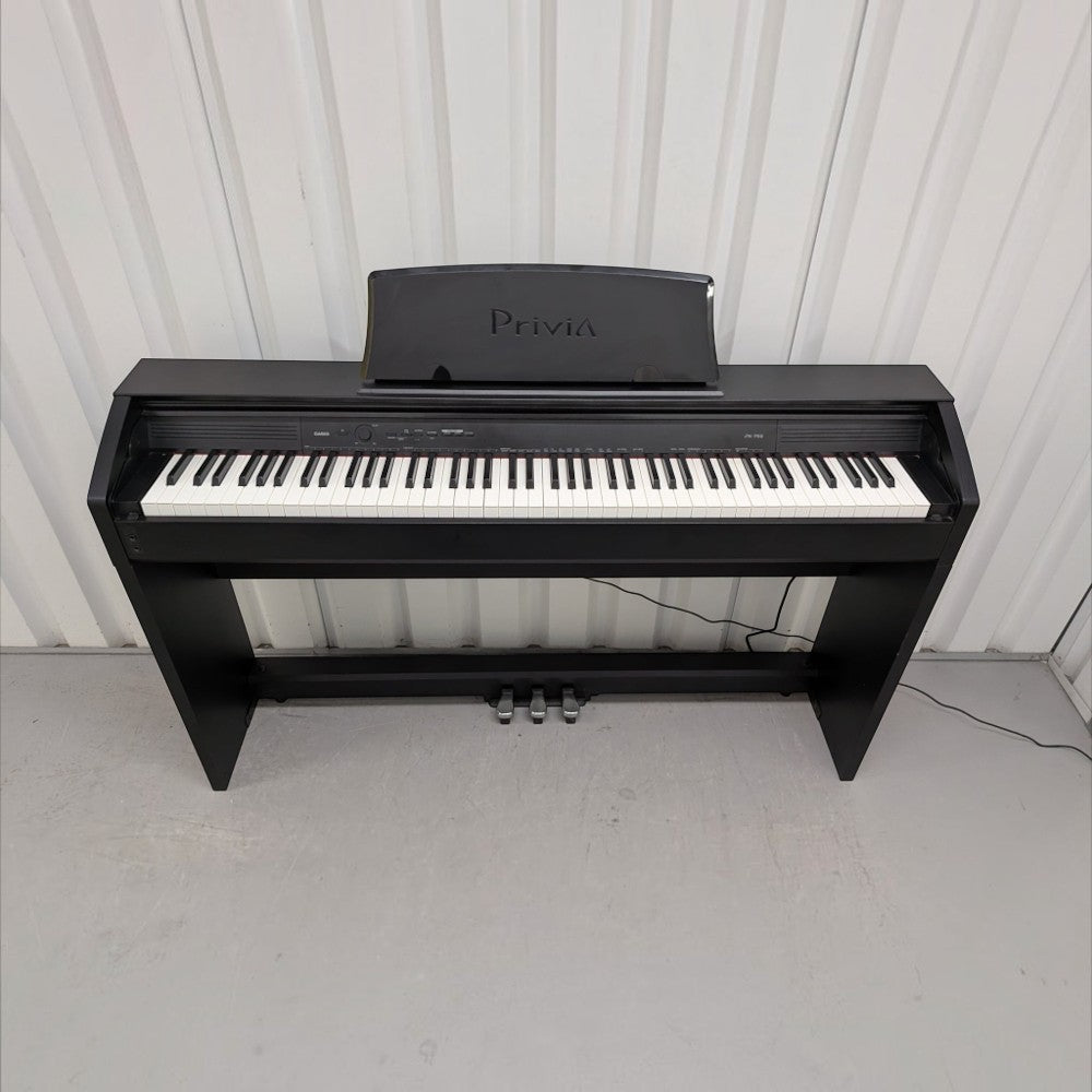 Đàn piano điện TÂN NHẠC CỤ Casio PX750 màu đen dáng tủ với 88 phím búa đàn và nắp phím trượt