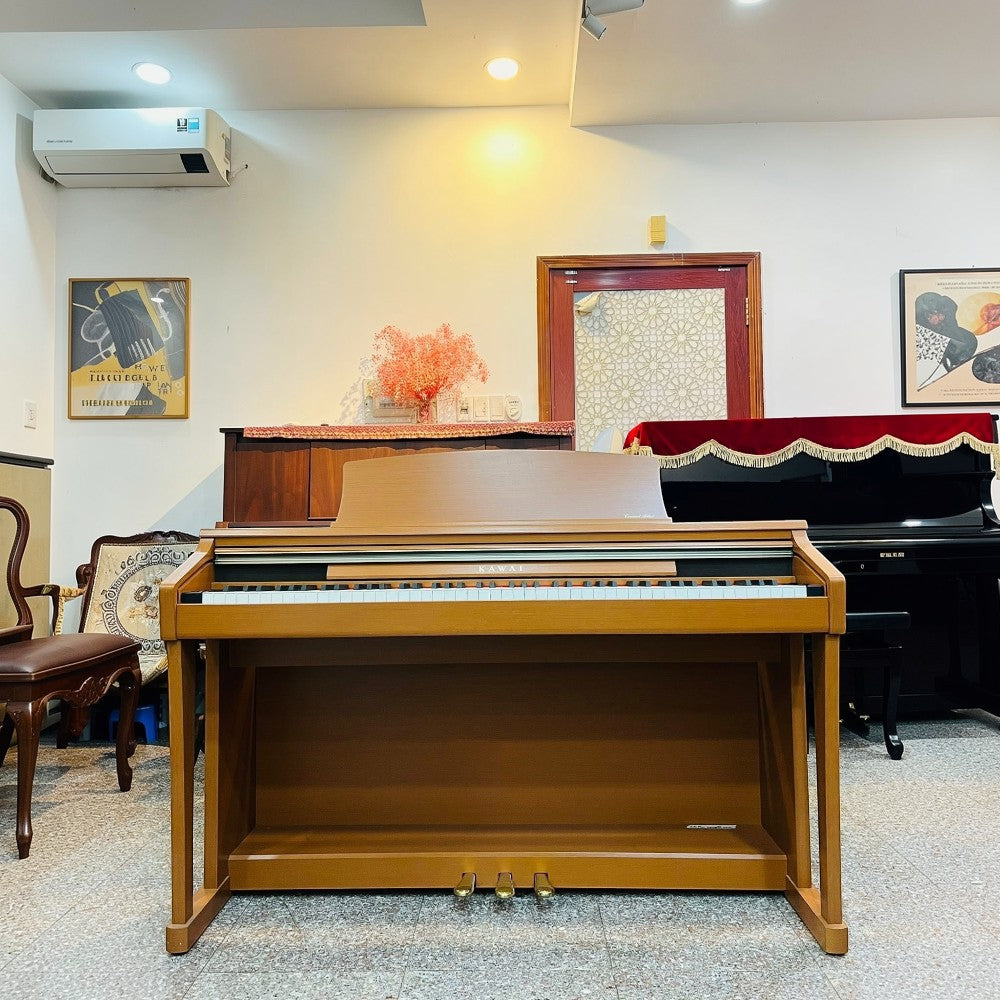 Đàn piano điện Kawai CA13 màu gỗ tại showroom TÂN NHẠC CỤ, thiết kế dáng tủ sang trọng với bàn phím gỗ RM3 Grand.
