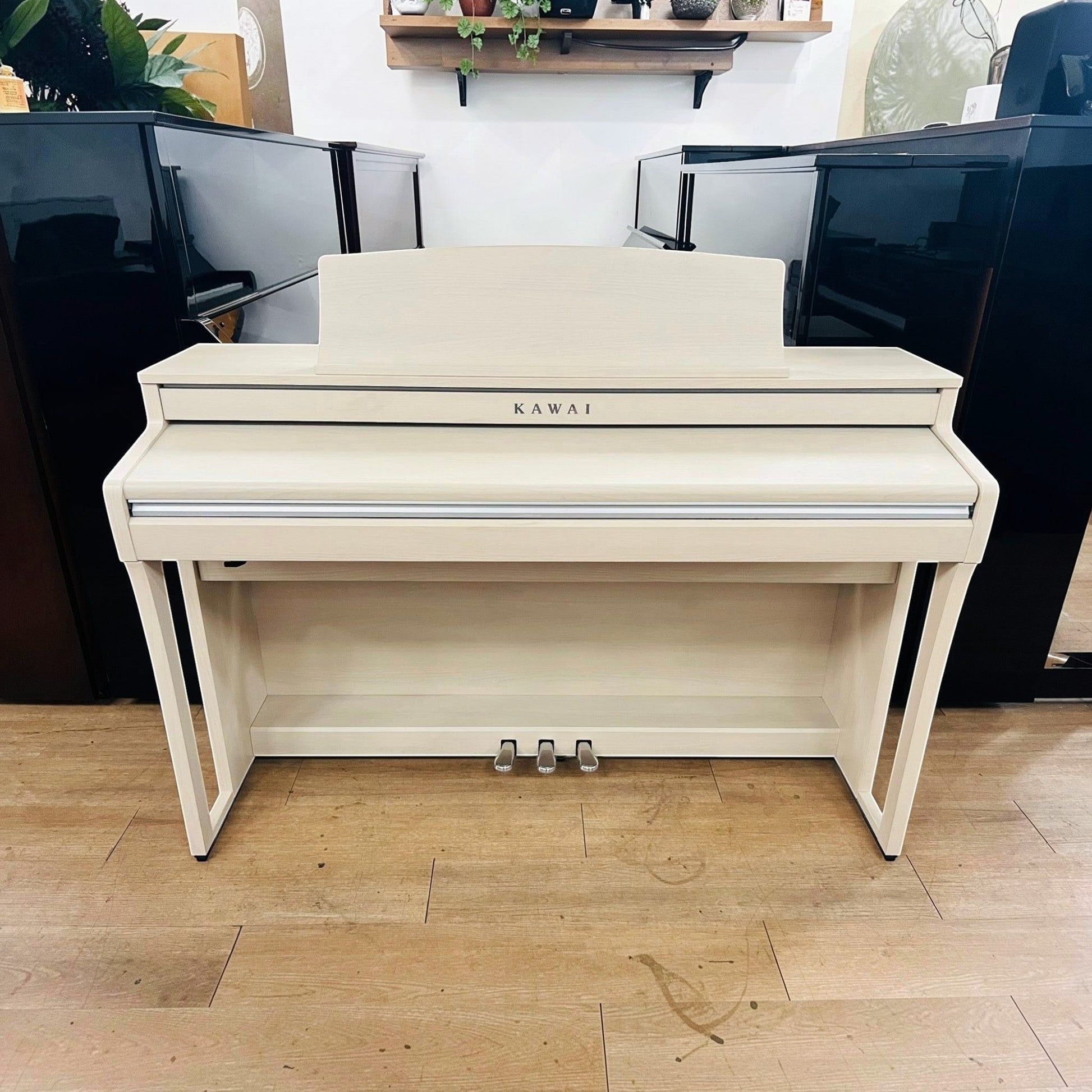 Đàn piano điện Kawai CA49 màu trắng dáng tủ tại TÂN NHẠC CỤ với bàn phím gỗ Grand Feel Compact cao cấp