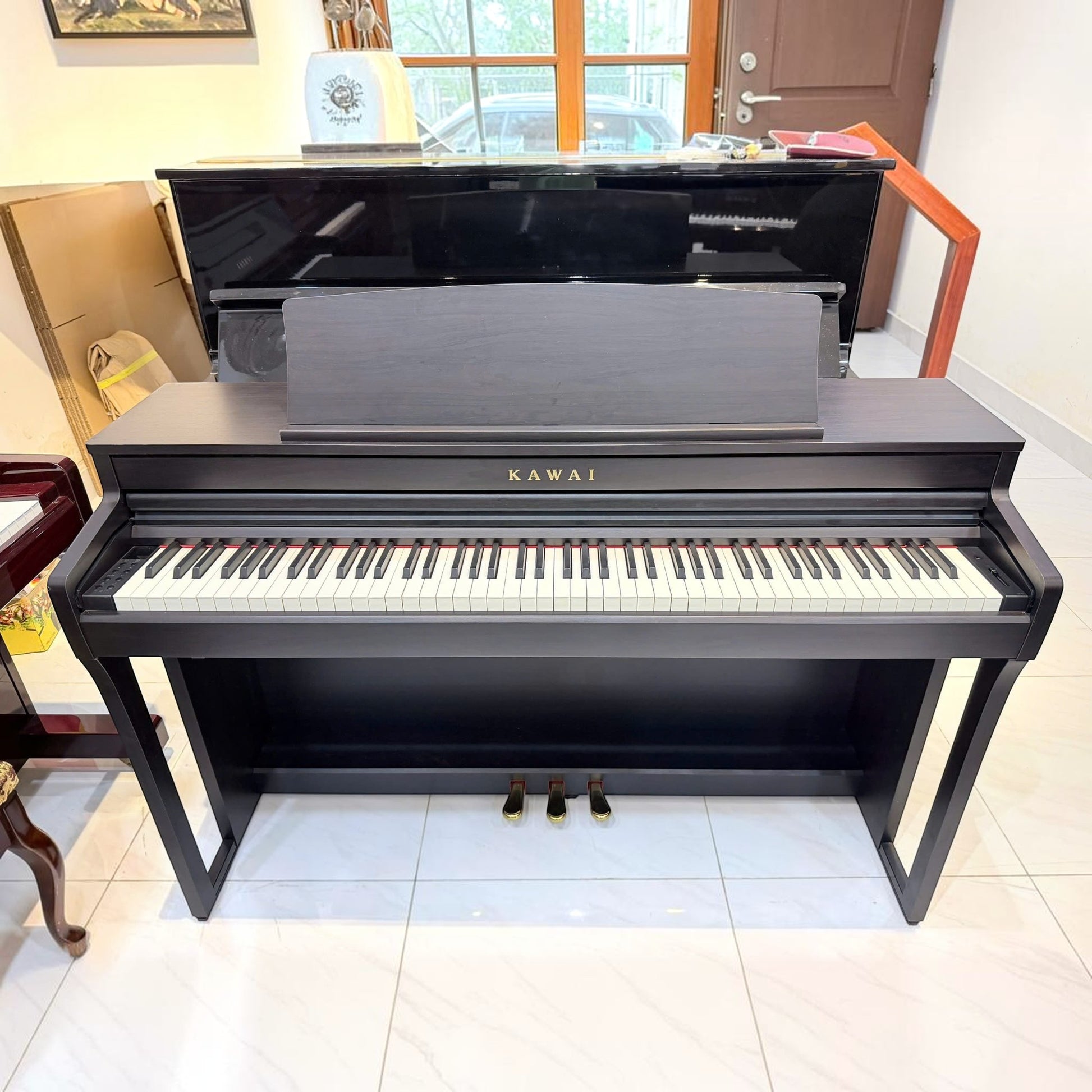 Đàn piano điện Kawai CA49 dáng tủ màu đen tại TÂN NHẠC CỤ với bàn phím gỗ Grand Feel Compact cao cấp