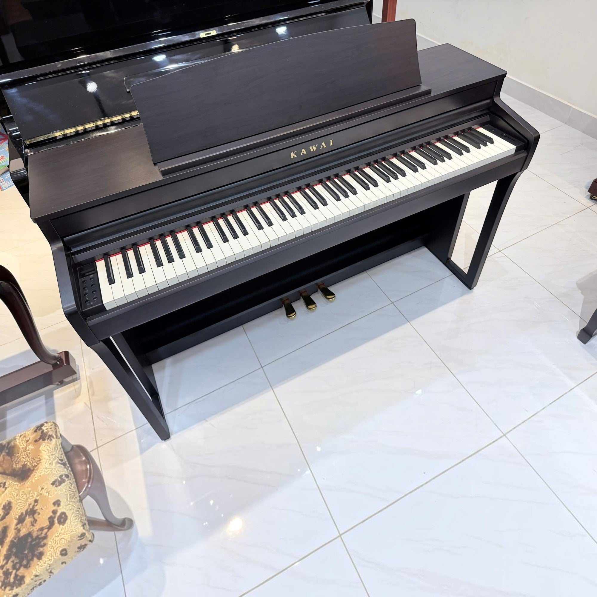 Đàn piano điện Kawai CA49 dáng tủ màu đen sang trọng với bàn phím gỗ Grand Feel Compact tại Tân Nhạc Cụ