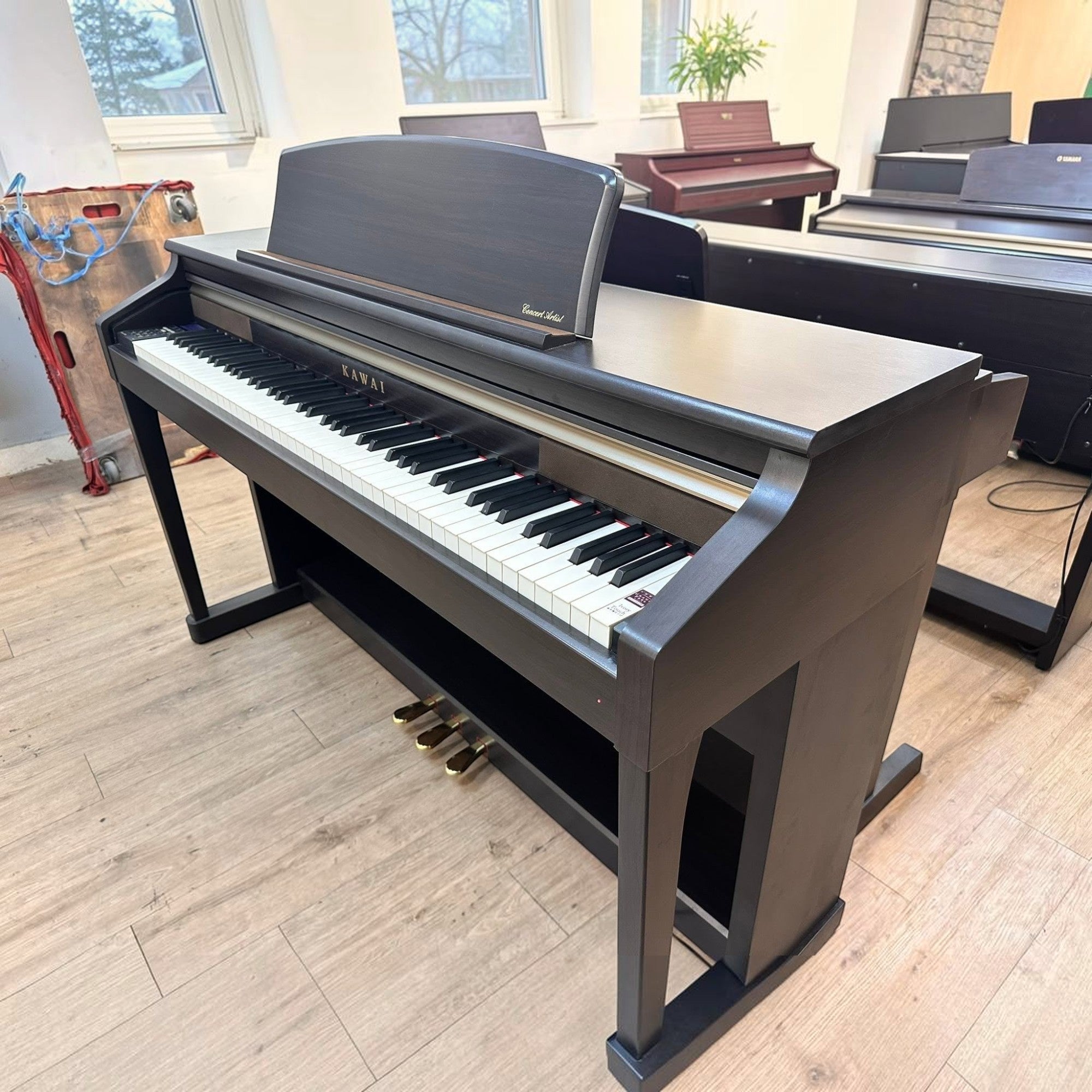 Đàn piano điện Kawai CA65 màu nâu đậm dáng tủ với phím gỗ Grand Feel tại cửa hàng TÂN NHẠC CỤ