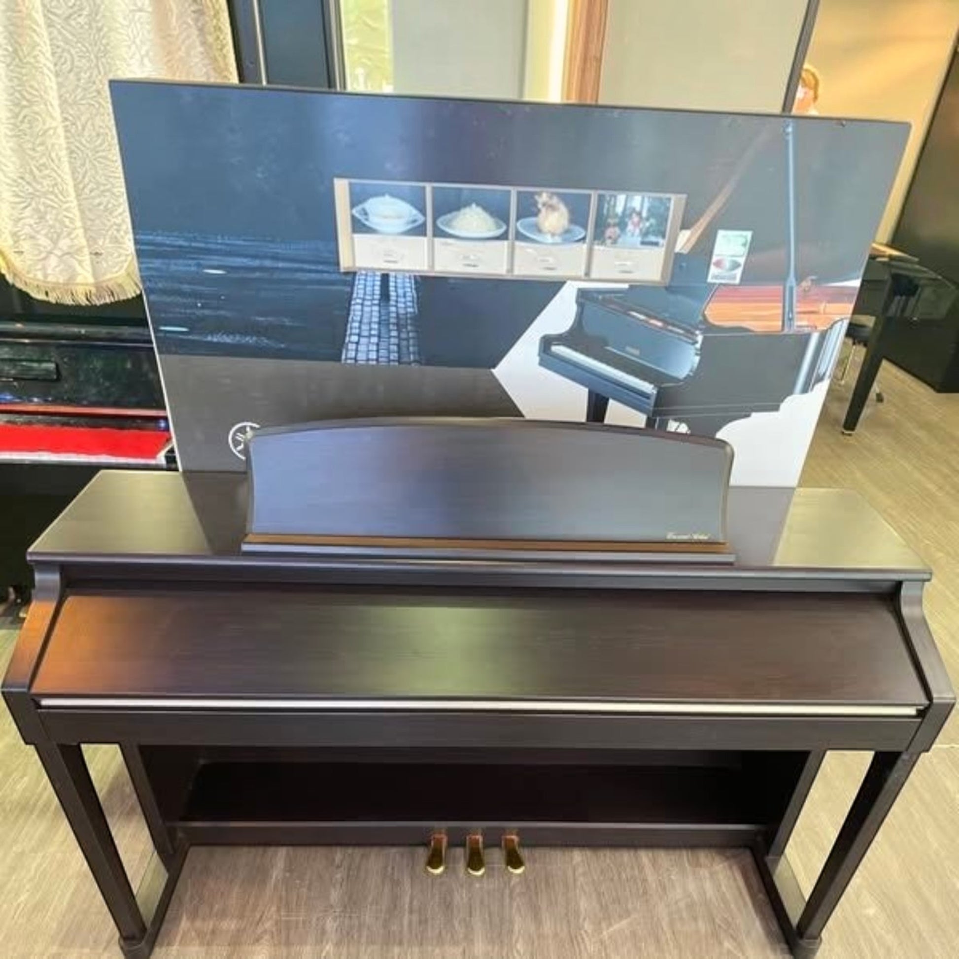 Đàn piano điện Kawai CA65 màu nâu đậm dáng tủ sang trọng tại showroom TÂN NHẠC CỤ