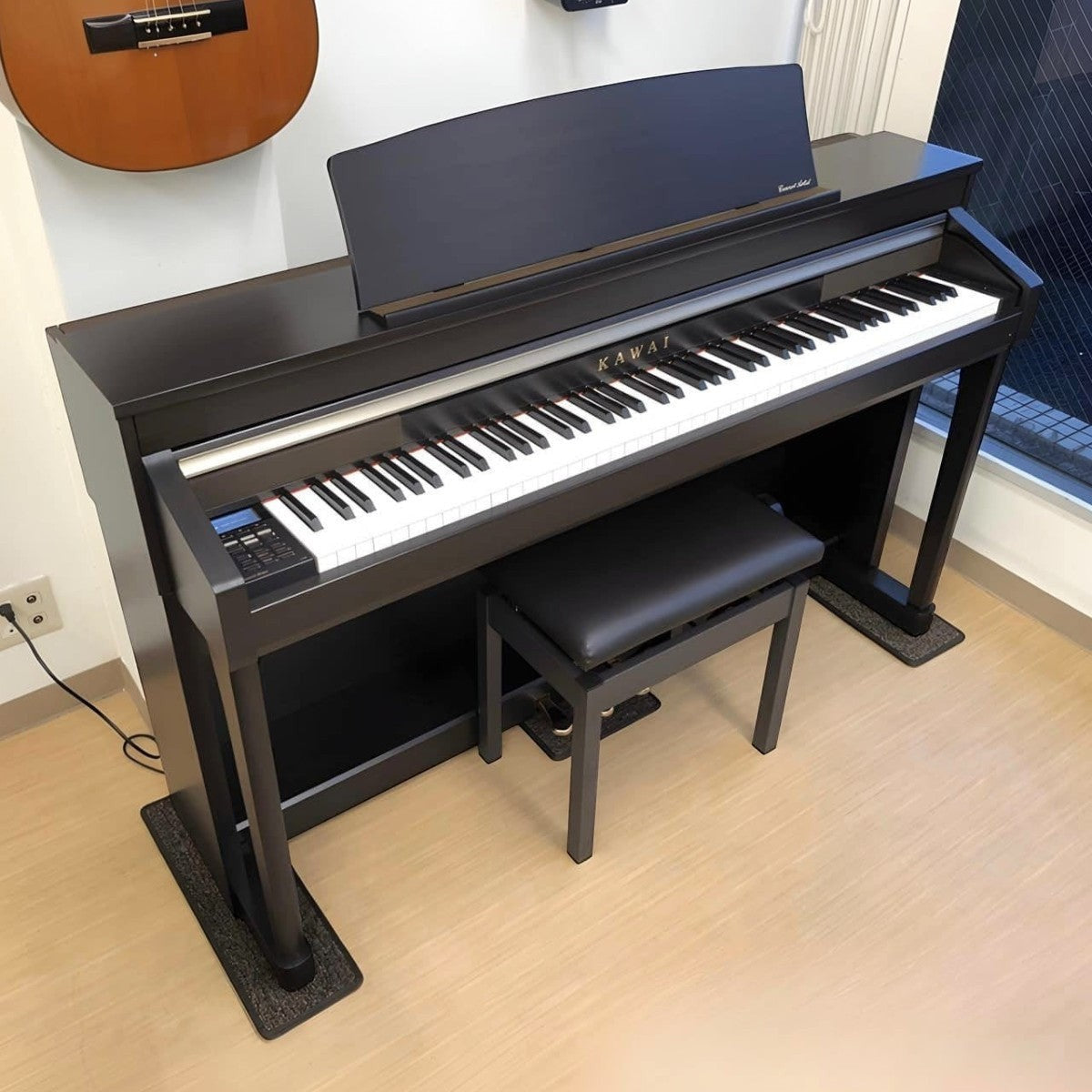 Đàn piano điện TÂN NHẠC CỤ Kawai CA67 màu đen với bàn phím gỗ Grand Feel II cao cấp và ghế đàn đi kèm