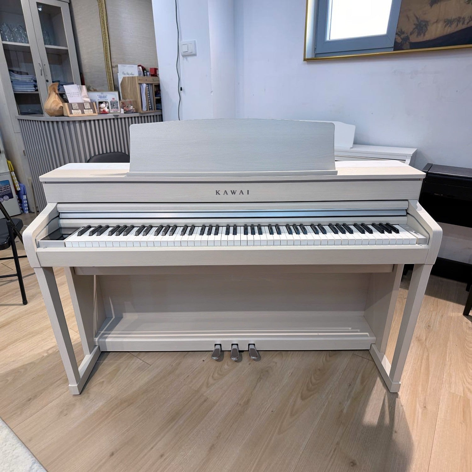 Đàn piano điện Kawai CA79 màu trắng tại Tân Nhạc Cụ với bàn phím gỗ Grand Feel III cao cấp
