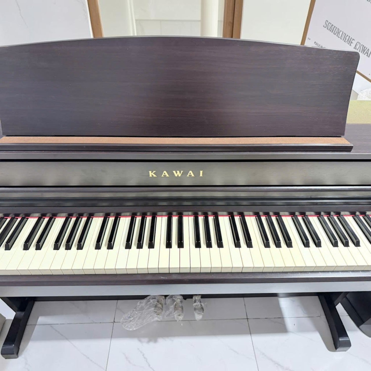 Đàn piano điện Kawai CA79 màu gỗ hồng tại TÂN NHẠC CỤ với bàn phím gỗ Grand Feel III cao cấp