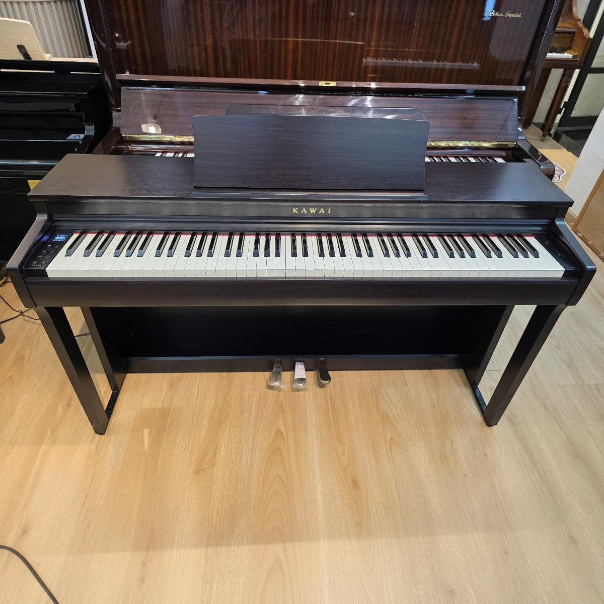 Đàn piano điện Kawai CN201 dáng tủ màu gỗ hồng tại TÂN NHẠC CỤ, thiết kế 88 phím búa sang trọng