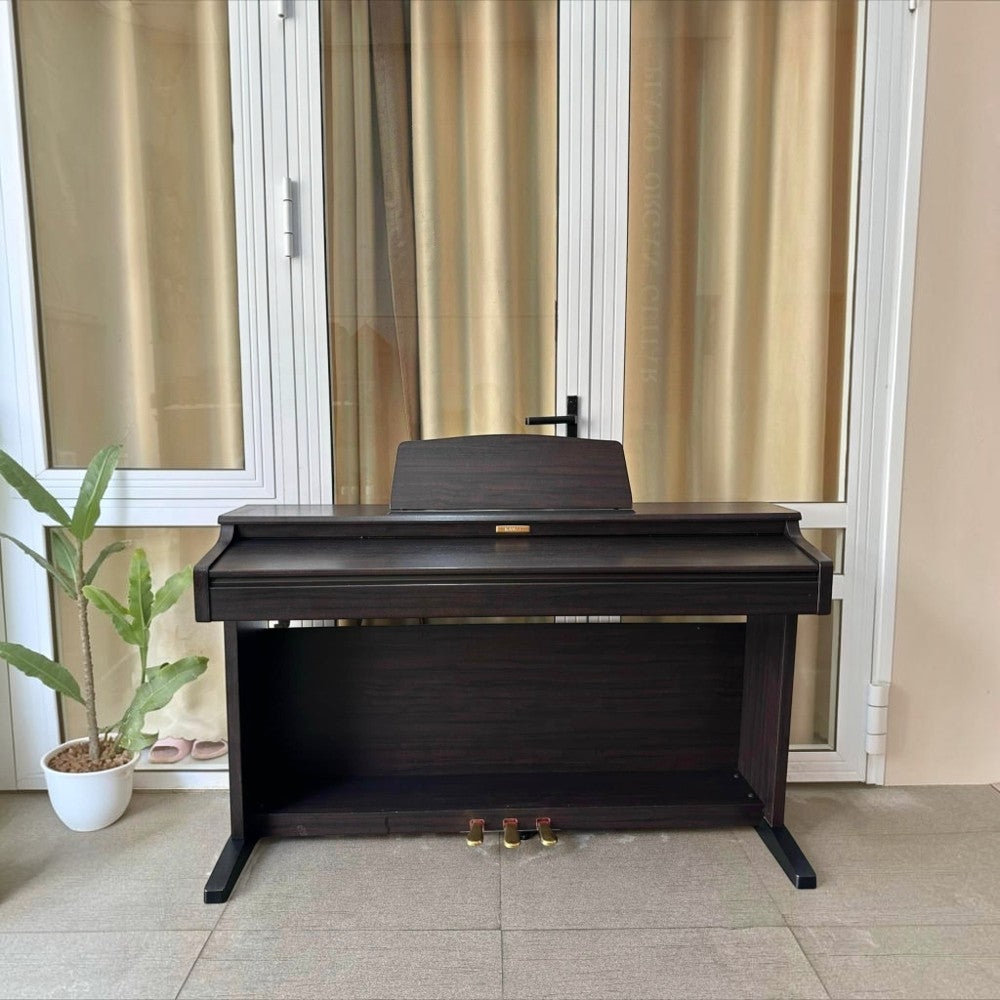 Đàn piano điện Kawai CN21 màu gỗ tối tại Tân Nhạc Cụ, thiết kế dáng tủ sang trọng với 88 phím búa đàn AHA IV.