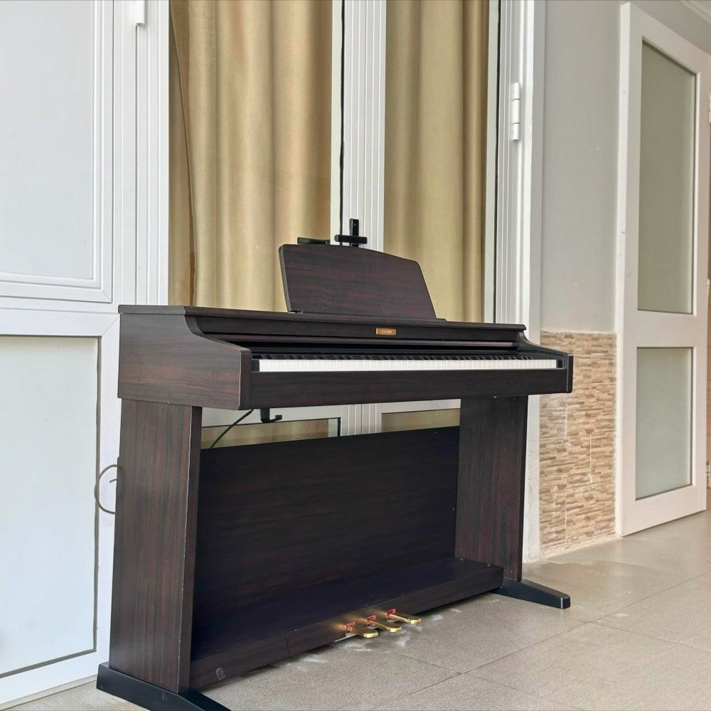 Đàn piano điện Kawai CN21 dáng tủ màu gỗ tối sang trọng tại TÂN NHẠC CỤ, thiết kế 88 phím búa AHA IV chắc chắn.