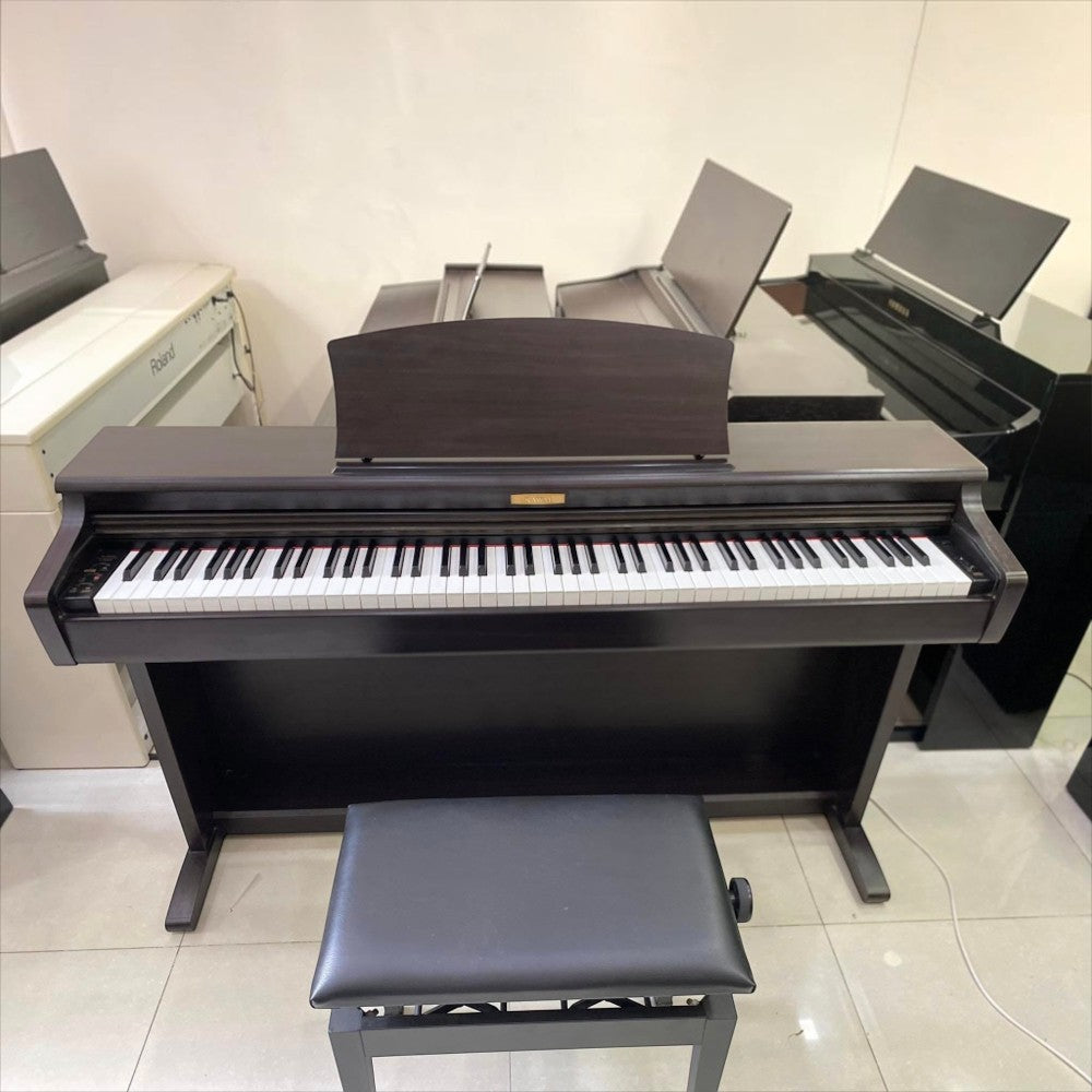 Đàn piano điện Kawai CN22 dáng tủ màu nâu gỗ sang trọng tại TÂN NHẠC CỤ, kèm ghế ngồi và bàn phím búa 88 phím.