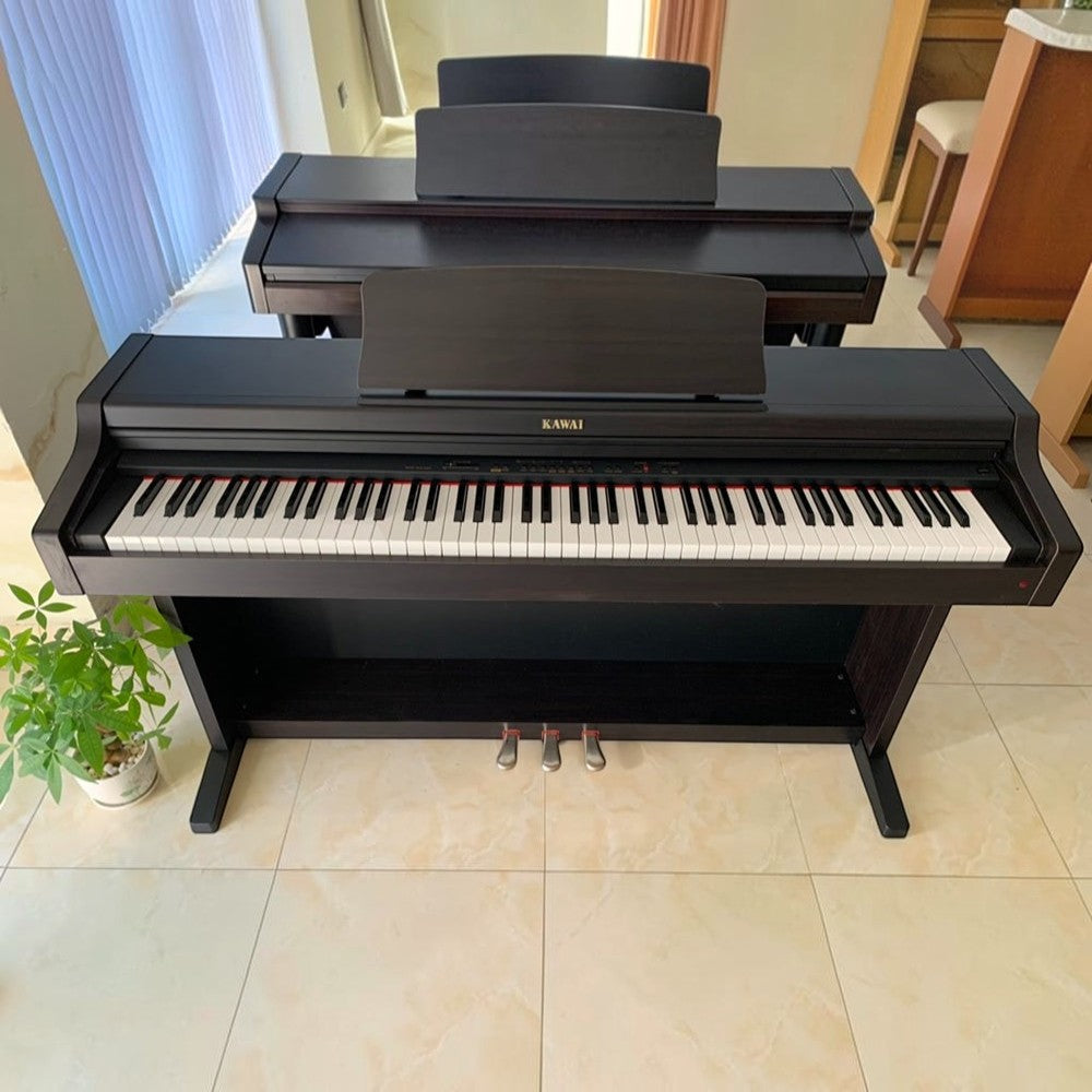 Đàn piano điện Kawai PN270 dáng tủ gỗ màu nâu đen sang trọng tại showroom Tân Nhạc Cụ
