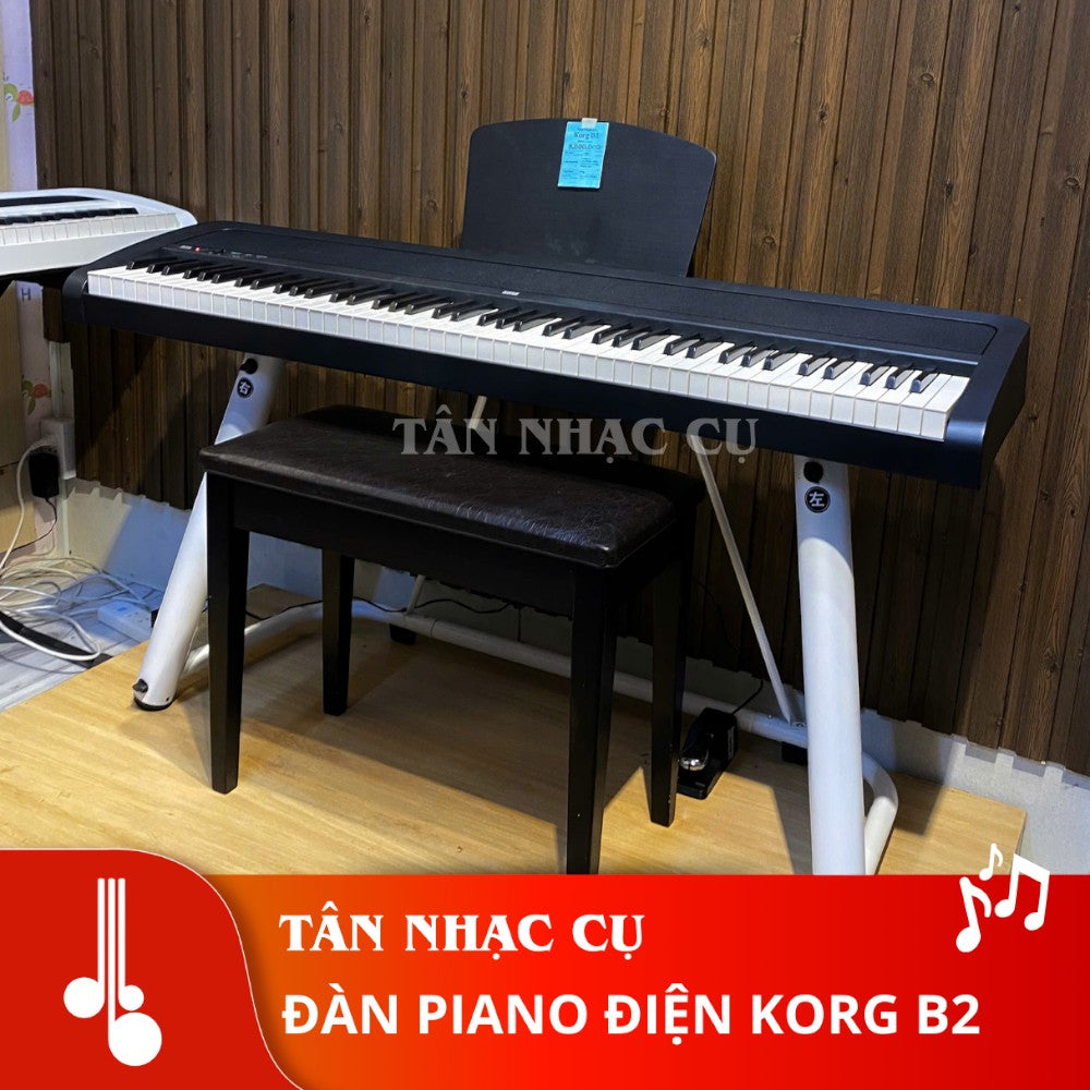 Đàn piano điện Korg B2 màu đen tại TÂN NHẠC CỤ với thiết kế gọn nhẹ, bàn phím búa NH và ghế ngồi đi kèm.