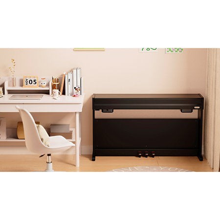 Đàn piano điện Nux NCK330 màu đen thiết kế hiện đại, nhỏ gọn đặt trong phòng làm việc tại TÂN NHẠC CỤ