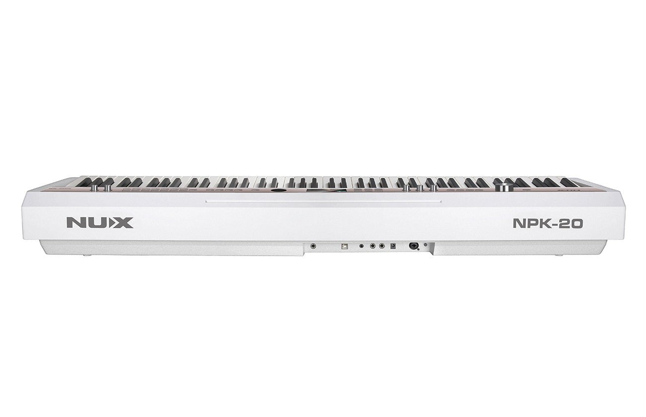 Đàn piano điện NUX NPK-20 màu trắng tại Tân Nhạc Cụ với thiết kế 88 phím búa hiện đại và các cổng kết nối phía sau
