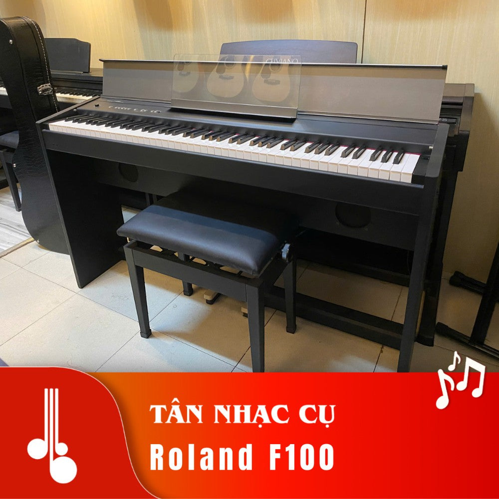 Đàn piano điện Roland F100 màu đen thiết kế dáng tủ gọn gàng tại TÂN NHẠC CỤ, kèm ghế đàn và giá nhạc trong suốt