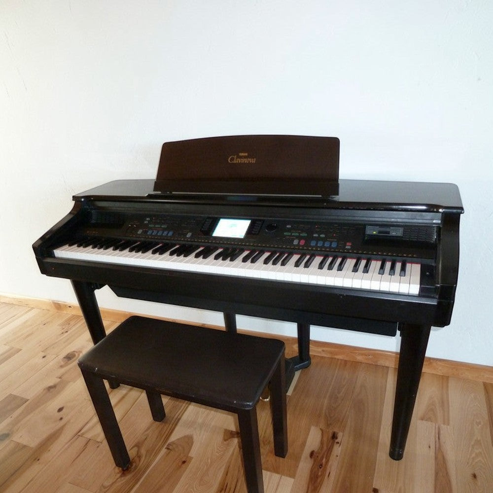 Đàn piano điện Yamaha CVP-69 màu đen dáng tủ sang trọng tại TÂN NHẠC CỤ, kèm ghế ngồi đồng bộ.