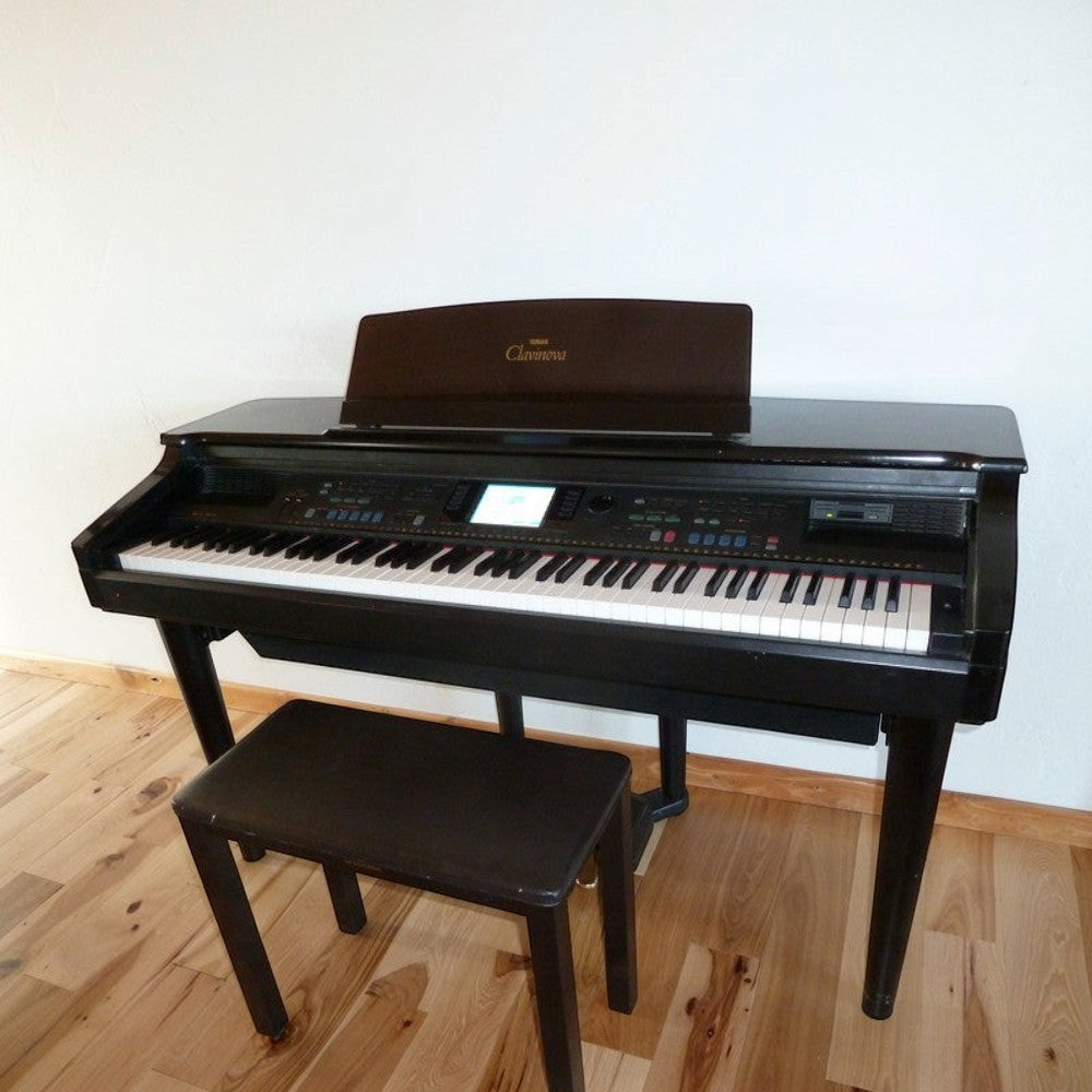 Đàn piano điện Yamaha CVP-69 cũ màu đen dáng tủ sang trọng tại TÂN NHẠC CỤ, kèm ghế ngồi đồng bộ.