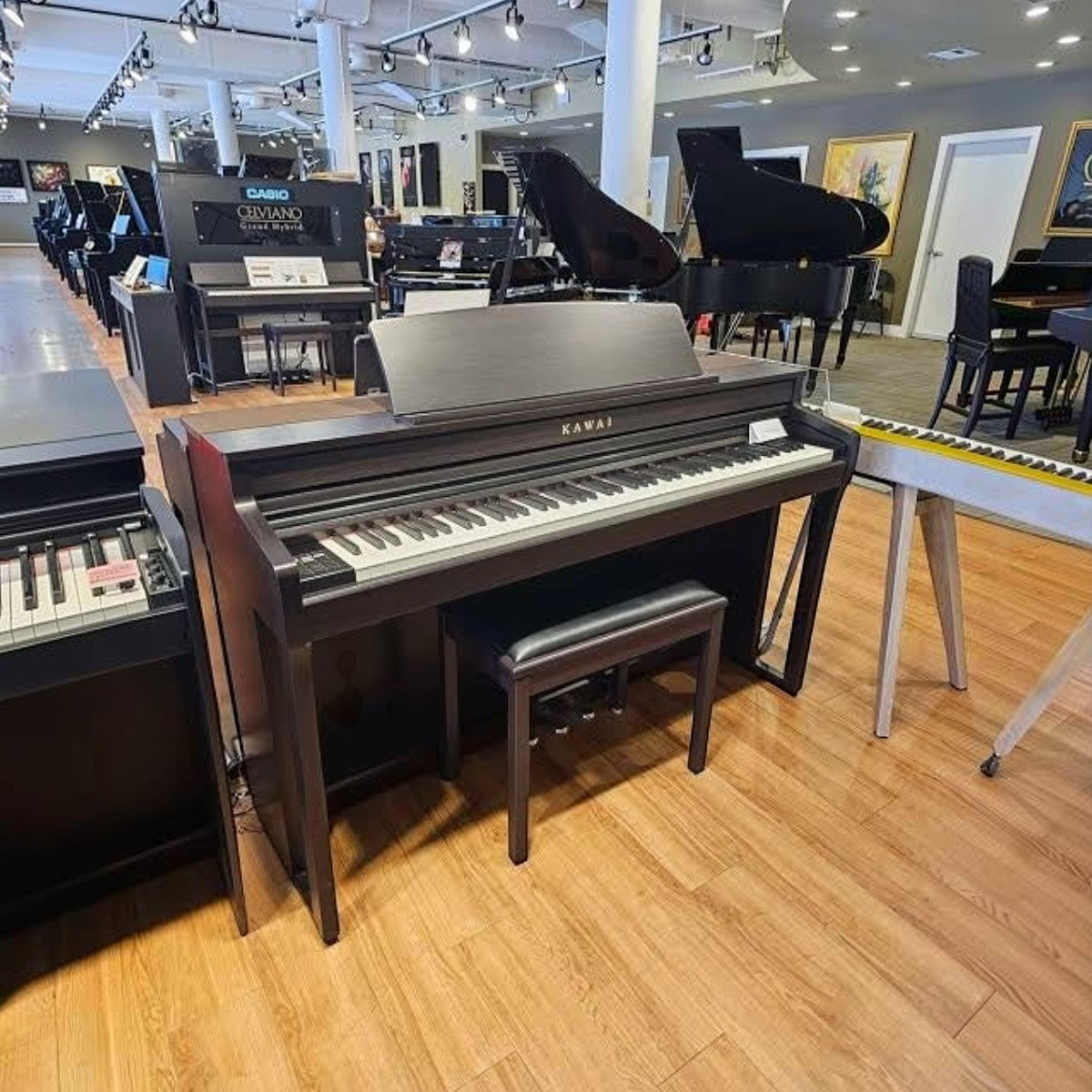 Đàn piano điện TÂN NHẠC CỤ Kawai CA59 màu đen với bàn phím gỗ Grand Feel Compact tại showroom